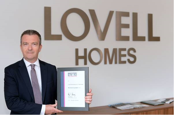 Simon Medler, regional managing director at Lovell, pictured with the Investors in People certificate